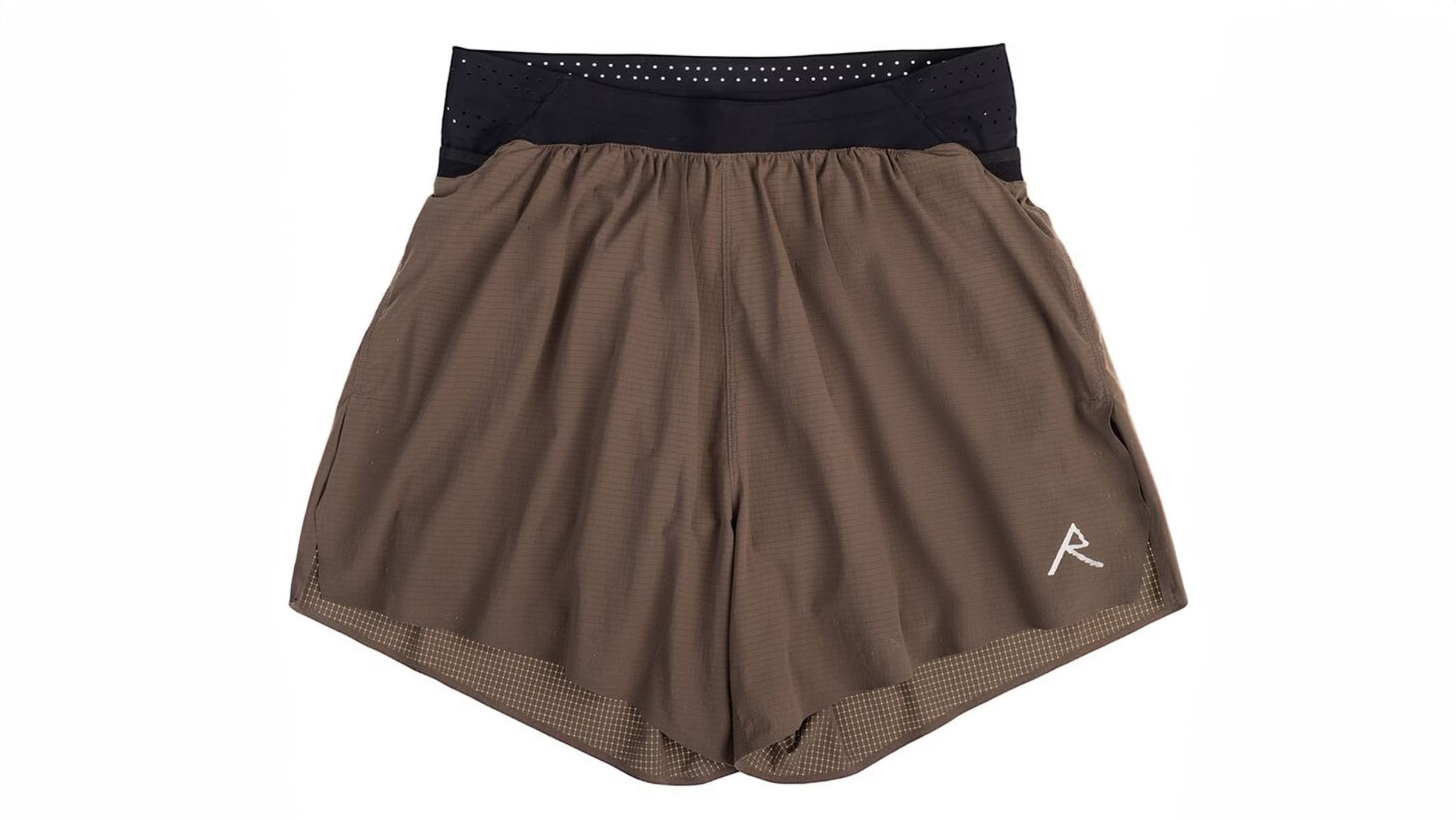 Brown Raide technical trail shorts featuring a perforated black stretch waistband. Built for maximum mobility and comfort during long fastpacking days.